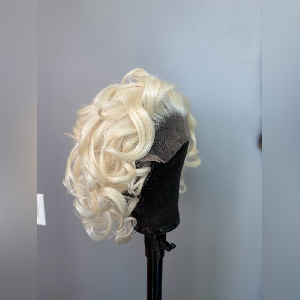 Brand new 13x3 platinum blonde synthetic loose curl wavy wig. 10 inches